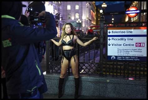 . 26 02 2018. London, United Kingdom. Beast from the East - London Weather. A model wearing only lingerie braves the freezing weather to pose for a film crew in London s Piccadilly Circus.  xPetexMaclainex xi-Imagesx IIM-17072-0010