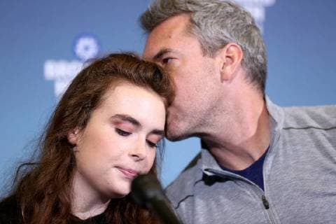 February 26, 2018 - Deerfield Beach, Florida, U.S. - Marjory Stoneman Douglas shooting survivor MADDY WILFORD gets a kiss from her father, DAVID WILFORD, during a news conference on Monday, at Broward Health North. Wilford, the Marjory Stoneman Douglas High School junior who survived the Florida shooting, was discharged from Broward Health North on Monday. She had been shot three times and was barely clinging to life. One bullet pierced her chest, another her torso and the third traveled through her right arm. Deerfield Beach U.S. - ZUMAm67_ 20180226_zaf_m67_002 Copyright: xAmyxBethxBennettx