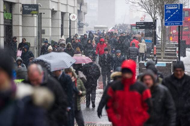 . 01 03 2018. London, United Kingdom. Beast from the East. People seen walking between Monument station and London Bridge under a snow storm. Beast from the east batters Britain for third day causing severe weather warning issued for snow and ice.  xGustavoxValientex xi-Imagesx IIM-17108-0021