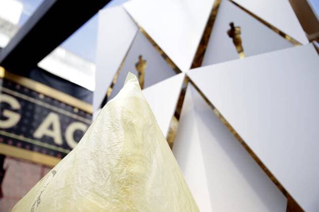 An Oscar statue is wrapped in plastic on the red carpet as preparations continue for the 90th annual Academy Awards in the Hollywood section of Los Angeles on March 3, 2018. Oscar winners will be announced during an ABC telecast on Sunday, March 4th at the Dolby Theatre.  LAP20180303901 JOHNxANGELILLO