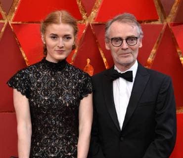 Cinematographer Dan Laustsen (R) and guest arrive on the red carpet for the 90th annual Academy Awards at the Dolby Theatre in the Hollywood section of Los Angeles on March 4, 2018.  LAP20180304353 JIMxRUYMEN