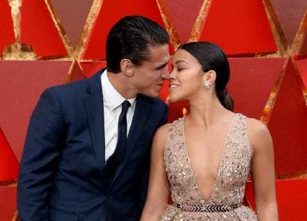 Actors Joe LoCicero (L) and Gina Rodriguez arrive on the red carpet for the 90th annual Academy Awards at the Dolby Theatre in the Hollywood section of Los Angeles on March 4, 2018.  LAP20180304368 JIMxRUYMEN