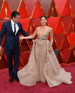Actors Joe LoCicero (L) and Gina Rodriguez arrive on the red carpet for the 90th annual Academy Awards at the Dolby Theatre in the Hollywood section of Los Angeles on March 4, 2018.  LAP20180304365 JIMxRUYMEN