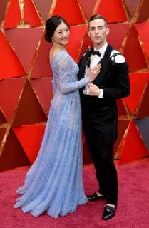 Figure skaters Mirai Nagasu (L) and Adam Rippon arrive on the red carpet for the 90th annual Academy Awards at the Dolby Theatre in the Hollywood section of Los Angeles on March 4, 2018.  LAP20180304385 JIMxRUYMEN