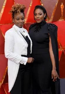 Screenwriter Dee Rees and Sarah Brown arrive on the red carpet for the 90th annual Academy Awards at the Dolby Theatre in the Hollywood section of Los Angeles on March 4, 2018.  LAP20180304901 JIMxRUYMEN
