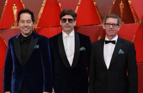 Production designer Paul Denham Austerberry (L) and set decorators Shane Vieau (C) and Jeffrey A. Melvin arrive on the red carpet for the 90th annual Academy Awards at the Dolby Theatre in the Hollywood section of Los Angeles on March 4, 2018.  LAP20180304496 JIMxRUYMEN