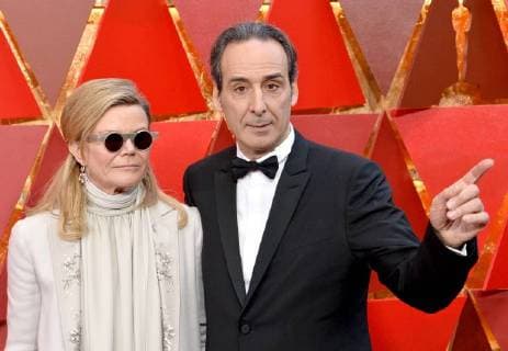 Dominique Lemonnier (L) and composer Alexandre Desplat arrive on the red carpet for the 90th annual Academy Awards at the Dolby Theatre in the Hollywood section of Los Angeles on March 4, 2018.  LAP20180304945 JIMxRUYMEN