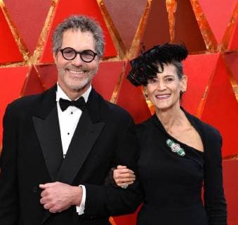 Production designer Dennis Gassner (L) and guest arrive on the red carpet for the 90th annual Academy Awards at the Dolby Theatre in the Hollywood section of Los Angeles on March 4, 2018.  LAP20180304512 JIMxRUYMEN
