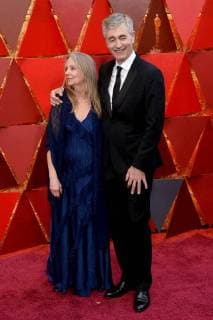 Producer Steve James (R) and guest arrive on the red carpet for the 90th annual Academy Awards at the Dolby Theatre in the Hollywood section of Los Angeles on March 4, 2018.  LAP20180304523 JIMxRUYMEN