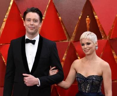 Theo Green (L) and guest arrive on the red carpet for the 90th annual Academy Awards at the Dolby Theatre in the Hollywood section of Los Angeles on March 4, 2018.  LAP201803041055 JIMxRUYMEN
