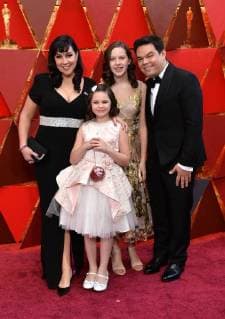 Songwriters Kristen Anderson-Lopez, Robert Lopez, and family arrive on the red carpet for the 90th annual Academy Awards at the Dolby Theatre in the Hollywood section of Los Angeles on March 4, 2018.  LAP20180304536 JIMxRUYMEN