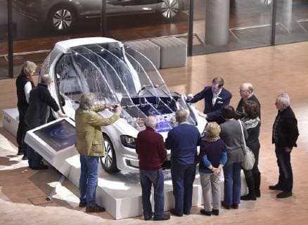 5 3 2018 e Golf production in the Transparent Factory of Volkswagen in Dresden from mid-April 2018 the daily production of the electric vehicle will be increased from 36 to 72 a group of visitors will look at a model of the current e Golf in the exhibition area of u200b u200bthe Dresden Saxony Germany manufactory