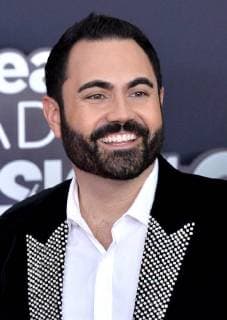 Radio host Enrique Santos arrives for the iHeartRadio Music Awards at The Forum in Inglewood, California on March 11, 2018. Turner s TBS, TNT, and truTV channels broadcasted the ceremony live from The Forum.  LAP20180311052 JIMxRUYMEN