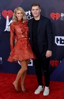 Paris Hilton (L) and Chris Zylka arrive for the iHeartRadio Music Awards at The Forum in Inglewood, California on March 11, 2018. Turner s TBS, TNT, and truTV channels broadcasted the ceremony live from The Forum.  LAP20180311097 JIMxRUYMEN