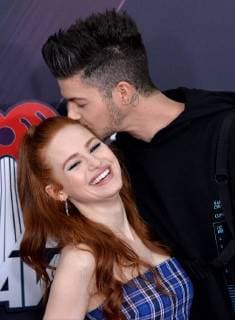 (L-R) Actors Madelaine Petsch and Travis Mills arrive for the iHeartRadio Music Awards at The Forum in Inglewood, California on March 11, 2018. Turner s TBS, TNT, and truTV channels broadcasted the ceremony live from The Forum.  LAP20180311140 JIMxRUYMEN