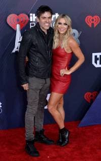 (L-R) Edwin Arroyave and Teddi Mellencamp arrive for the iHeartRadio Music Awards at The Forum in Inglewood, California on March 11, 2018. Turner s TBS, TNT, and truTV channels broadcasted the ceremony live from The Forum.  LAP20180311208 JIMxRUYMEN