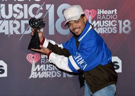 Chance the Rapper, winner of the Innovator Award, appears backstage during the iHeartRadio Music Awards at The Forum in Inglewood, California on March 11, 2018. Turner s TBS, TNT, and truTV channels broadcasted the ceremony live from The Forum.  LAP20180311221 JIMxRUYMEN