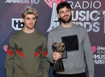 Andrew Taggart (L) and Alex Pall of The Chainsmokers, winners of Best Collaboration for Something Just Like This; Dance Artist of the Year; and Dance Album of the Year for Memories...Do Not Open, appear backstage during the iHeartRadio Music Awards at The Forum in Inglewood, California on March 11, 2018. Turner s TBS, TNT, and truTV channels broadcasted the ceremony live from The Forum.  LAP20180311261 JIMxRUYMEN