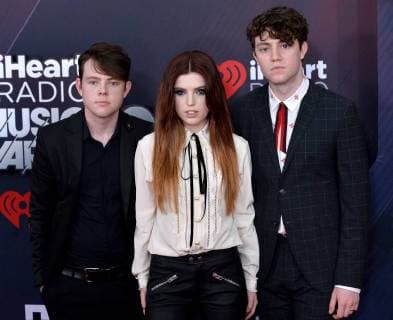 (L-R) Graham Sierota, Sydney Sierota, and Noah Sierota of Echosmith arrive for the iHeartRadio Music Awards at The Forum in Inglewood, California on March 11, 2018. Turner s TBS, TNT, and truTV channels broadcasted the ceremony live from The Forum.  LAP20180311274 JIMxRUYMEN