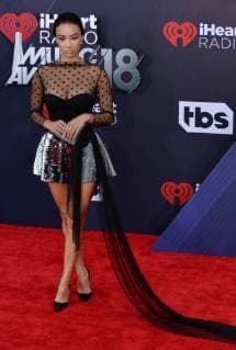 Media personality Draya Michelle arrives for the iHeartRadio Music Awards at The Forum in Inglewood, California on March 11, 2018. The ceremony was broadcast live from The Forum on Turner s TBS, TNT, and truTV.  LAP20180311800
