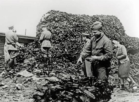 Auschwitz Concentration Camp Russian soldiers inspect a pile of shoes On January 27, 1945, the Soviet army invaded Auschwitz and released more than 7,000 prisoners, most of whom were sick and dying Poles Date 28 January 1945