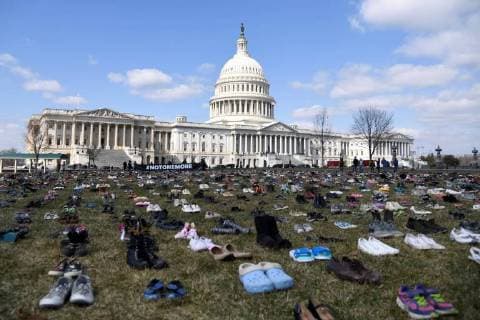 (180313) -- WASHINGTON, March 13, 2018 -- Shoes representing the children killed in school shootings since Sandy Hook Elementary School shooting in 2012 are seen on the lawn in front of the Capitol in Washington D.C., the United States, on March 13, 2018. An activist group on Tuesday placed 7,000 pairs of shoes on the lawn in front of U.S. Congress, in protest against lawmakers inaction in face of frequent school shootings in the country. ) U.S.-WASHINGTON D.C.-SCHOOL SHOOTINGS-PROTEST-SHOES YangxChenglin 