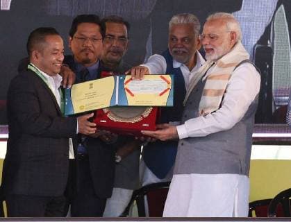 NEW DELHI, INDIA - MARCH 17: Prime Minister Narendra Modi presents Krishi Karman Award to Meghalaya Chief Minister Conrad Sangma during the Krishi Unnati Mela 2018, at Pusa, on March 17, 2018 in New Delhi, India. Prime Minister Narendra Modi on Saturday said confusion is being spread about the budget decision to fix MSP for crops, at least 1.5 times the production cost, and assured farmers that all major costs incurred will be included while declaring the support price. (Photo by Raj K Raj Hindustan Times ) Prime Minister Narendra Modi Addresses Krishi Unnati Mela 2018