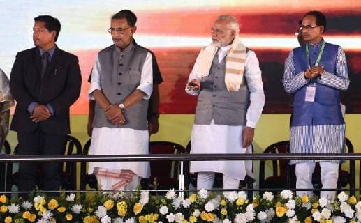 NEW DELHI, INDIA - MARCH 17: Prime Minister Narendra Modi along with Radha Mohan Singh Union Minister of Agriculture and Farmers Welfare, Meghalaya Chief Minister Conrad Sangma, Madhya Pradesh Chief Minister Shivraj Singh Chouhan during the Krishi Unnati Mela 2018, at Pusa, on March 17, 2018 in New Delhi, India. Prime Minister Narendra Modi on Saturday said confusion is being spread about the budget decision to fix MSP for crops, at least 1.5 times the production cost, and assured farmers that all major costs incurred will be included while declaring the support price. (Photo by Raj K Raj Hindustan Times ) Prime Minister Narendra Modi Addresses Krishi Unnati Mela 2018