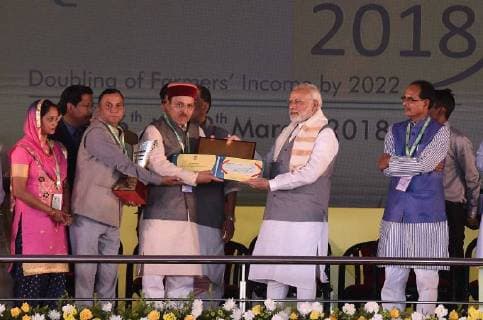 NEW DELHI, INDIA - MARCH 17: Prime Minister Narendra Modi presents Krishi Karman Award during the Krishi Unnati Mela 2018, at Pusa, on March 17, 2018 in New Delhi, India. Prime Minister Narendra Modi on Saturday said confusion is being spread about the budget decision to fix MSP for crops, at least 1.5 times the production cost, and assured farmers that all major costs incurred will be included while declaring the support price. (Photo by Raj K Raj Hindustan Times ) Prime Minister Narendra Modi Addresses Krishi Unnati Mela 2018
