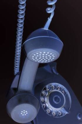 Old telephone handset hangs in the air Copyright: xKTHx ALLF915186