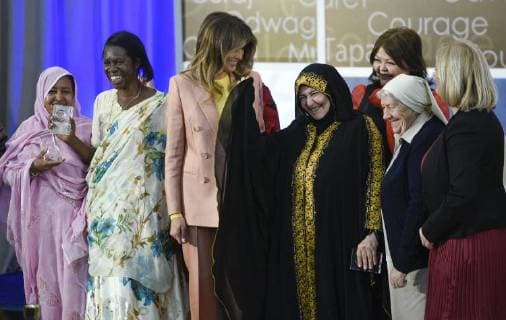 United States First Lady Melania Trump laughs as she stands for a photo with winners of the 2018 International Women of Courage Award, including L Malouma Said of Mauritania, Godelieve Mukasarasi of Rwanda, Dr. Julissa Villanueva of Honduras, Aliyah Khalaf Saleh of Iraq, Aiman Umarova of Kazakhstan, Sister Maria Elena Berini of Italy, and Dr. Fredide Rushdi of Kosovo during the Award Ceremony at the State Department in Washington, DC on March 23, 2018.  WAP20180323905 LEIGHxVOGEL