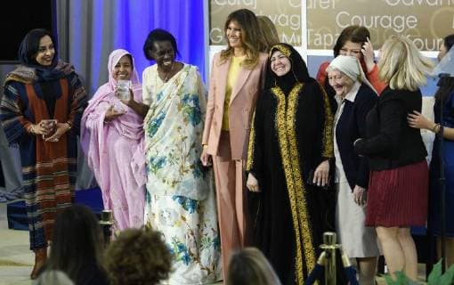 United States First Lady Melania Trump laughs as she stands for a photo with winners of the 2018 International Women of Courage Award, including L Malouma Said of Mauritania, Godelieve Mukasarasi of Rwanda, Dr. Julissa Villanueva of Honduras, Aliyah Khalaf Saleh of Iraq, Aiman Umarova of Kazakhstan, Sister Maria Elena Berini of Italy, Dr. Fredide Rushdi of Kosovo, and Sirikan Charoensiri of Thailand during the Award Ceremony at the State Department in Washington, DC on March 23, 2018. WAP20180323906
