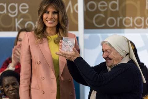 March 23, 2018 - Washington, DC, United States - (L-R): U.S. First Lady Melania Trump stands by, as Sister Maria Elena Berini of Italy holds up her award, at the annual International Women of Courage (IWOC) Awards at the U.S. Dept. of State, on Friday, March 23, 2018. Washington United States  - ZUMAn230 20180323_zaa_n230_696 Copyright: xCherissxMayx