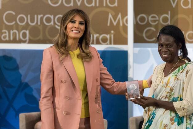 March 23, 2018 - Washington, DC, United States - (L-R): U.S. First Lady Melania Trump awards Godelieve Mukasarasi of Rwanda, Founder and Coordinator of the organization Solidarite pour l o°panouissement des Veuves et des Orphelins visant le Travail et l Auto promotion Solidarity for the Development of Widows and Orphans to Promote Self-Sufficiency and Livelihoods (SEVOTA), at the annual International Women of Courage (IWOC) Awards at the U.S. Dept. of State, on Friday, March 23, 2018. Washington United States  - ZUMAn230 20180323_zaa_n230_705 Copyright: xCherissxMayx
