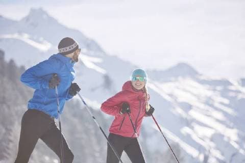Austria, Tyrol, Luesens, Sellrain, two cross-country skiers having a break model released Symbolfoto  CVF00160
