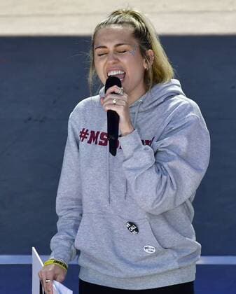 Miley Cyrus performs The Climb during the March for Our Lives rally on March 24, 2018 in Washington, D.C. Hundreds of thousands rallied in the nation s capital to demand action to end gun violence and mass shootings in schools.  WAP201803243123 DAVIDxTULIS
