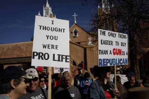 March 24, 2018 - Albuquerque, New Mexico, U.S - Marchers hold signs before the start of the March For Our Lives rally in Albuquerque, New Mexico Saturday March 24, 2018. Albuquerque U.S. - ZUMAv88_ 20180324_zap_v88_013 Copyright: xPatxVasquez-Cunninghamx