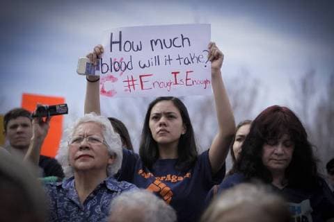 March 24, 2018 - Albuquerque, New Mexico, U.S - Fifteen year old CHALINA CATON-GARCIA (CQ), center, holds a sign while attending a rally with thousands of people at Tiguex Park in Albuquerque during the March For Our Lives rally in Albuquerque, New Mexico Saturday March 24, 2018. Albuquerque U.S. - ZUMAv88_ 20180324_zap_v88_016 Copyright: xPatxVasquez-Cunninghamx