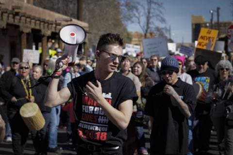 March 24, 2018 - Albuquerque, New Mexico, U.S - Youth organizer nineteen year old BLAIR DIXON, center, holds a megaphone at the start of the March For Our Lives rally in Albuquerque, New Mexico Saturday March 24, 2018. Albuquerque U.S. - ZUMAv88_ 20180324_zap_v88_009 Copyright: xPatxVasquez-Cunninghamx