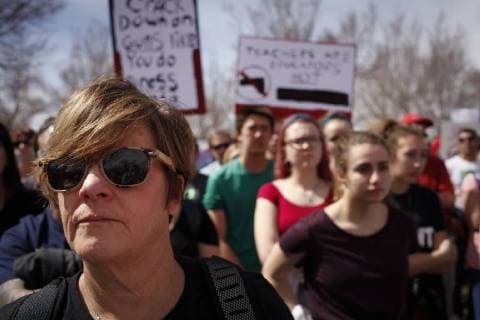 March 24, 2018 - Albuquerque, New Mexico, U.S - LESLIE KELLY (CQ), left foreground, of Albuquerque, N.M. attends a rally with thousands of people at Tiguex Park in Albuquerque during the March For Our Lives rally in Albuquerque, New Mexico Saturday March 24, 2018. Albuquerque U.S. - ZUMAv88_ 20180324_zap_v88_023 Copyright: xPatxVasquez-Cunninghamx