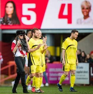 Katie PRICE does a lap of the pitch after her team wins 5-4 during the Sellebrity Soccer Benjamin Lewis Charity Cup Celebrity Football Match for Midland Air Ambulance & British Heart Foundation at the LCI Rail Stadium, Cheltenham, England on 25 March 2018. Copyright: xAndyxRowlandx PMI-1919