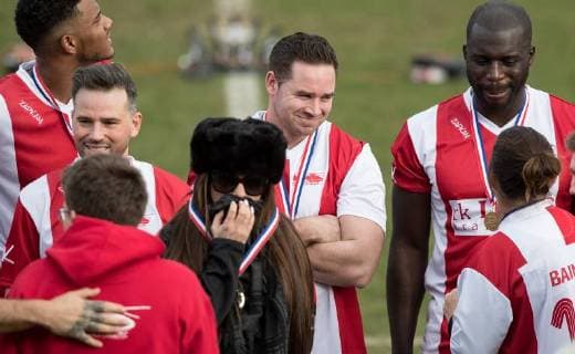 Kieran Hayler smiles with Katie Price in front of him before trophy lift during the Sellebrity Soccer Benjamin Lewis Charity Cup Celebrity Football Match for Midland Air Ambulance & British Heart Foundation at the LCI Rail Stadium, Cheltenham, England on 25 March 2018. Copyright: xAndyxRowlandx PMI-1919