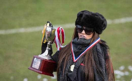 Katie Price lifts the winning trophy during the Sellebrity Soccer Benjamin Lewis Charity Cup Celebrity Football Match for Midland Air Ambulance & British Heart Foundation at the LCI Rail Stadium, Cheltenham, England on 25 March 2018. Copyright: xAndyxRowlandx PMI-1919