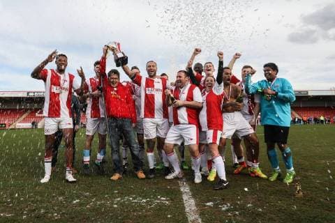 The winning team, Midland Air Ambulance, celebrate their victory after the Celebrity Charity Football Match hosted by Sellebrity Soccer for the Benjamin Lewis Charity Cub at the Abbey Business Stadium, Cheltenham, England on 25 March 2018. Copyright: xDavidxHornx PMI-1918