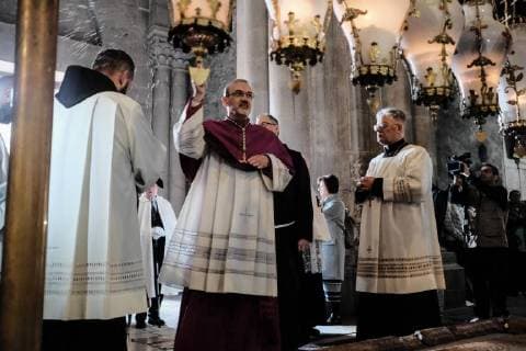 March 25, 2018 - Jerusalem, Israel - Archbishop PIERBATTISTA PIZZABALLA (C), Apostolic Administrator of Jerusalem, enters the Church of The Holy Sepulchre on Palm Sunday. Jerusalem Israel - ZUMAa126 20180325_zap_a126_005 Copyright: xNirxAlonx