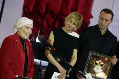 MOSCOW, RUSSIA â€“ MARCH 27, 2018: Actress Vera Kuzmina (L) of the Chuvash Drama Theatre receives a special 2018 Golden Mask award in the Outstanding contribution to the theatrical arts category, during a ceremony at the Bolshoi Theatre; centre: actress Ingeborga Dapkunaite, right: actor Anatoly Belykh. Vyacheslav Prokofyev TASS  TS079920
