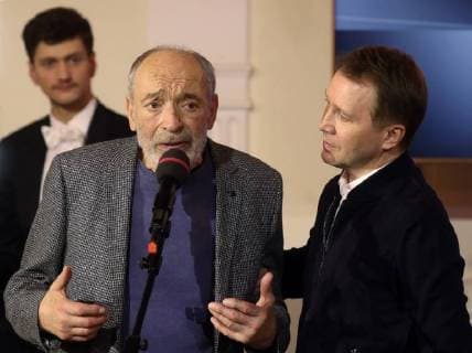 MOSCOW, RUSSIA â€“ MARCH 27, 2018: Actor Valentin Gaft (L front) speaks after he receives a special 2018 Golden Mask award in the Outstanding contribution to the theatrical arts category from actor Yevgeny Mironov (R), during a ceremony at the Bolshoi Theatre. Vyacheslav Prokofyev TASS  TS079926