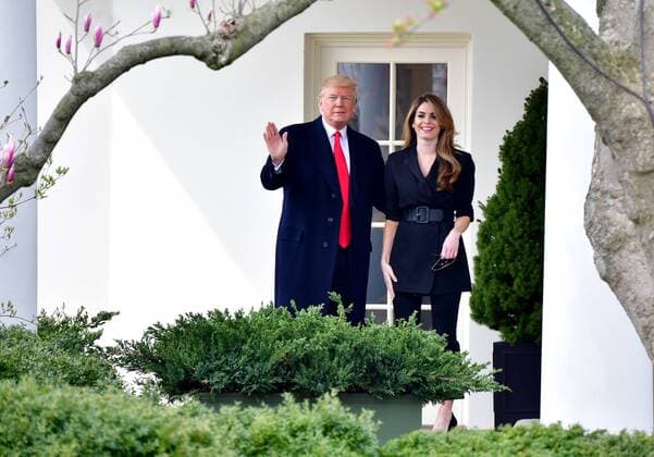 President Donald Trump waves alongside outgoing Communications Director Hope Hicks as Trump departs the White House for a day trip to Ohio to deliver remarks on his administration s infrastructure plan, on March 29, 2018 in Washington, D.C.  WAP20180329304 KEVINxDIETSCH