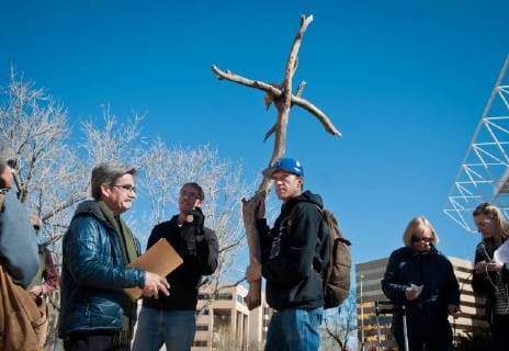 March 30, 2018 - Albuquerque, New Mexico, U.S. - -- Joe Heise of Albuquerque carries the cross from Civic Plaza to the downtown Albuquerque Police Department building during the Urban Way of the Cross, Good Friday, March 30, 2018. Several Albuquerque churches organized the annual silent walk around downtown Albuquerque, listening to personal stories about current issues including undocumented immigrants, food instability and gun control. This is what it is all about. This is the Christian journey, explained Susan Allison-Hatch, one of the organizers. Albuquerque U.S. - ZUMAab1_ 20180330_zaf_ab1_001 Copyright: xMarlaxBrosex