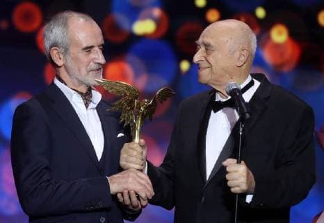 MOSCOW REGION, RUSSIA â€“ APRIL 1, 2018: Vakhtangov Theatre s Artistic Director Rimas Tuminas (L) and actor Vladimir Etush, the winner of a special prize Honour and Dignity , at the 31st Nika Film Award Ceremony, at the Vegas City Hall. Vyacheslav Prokofyev TASS  TS07A33D